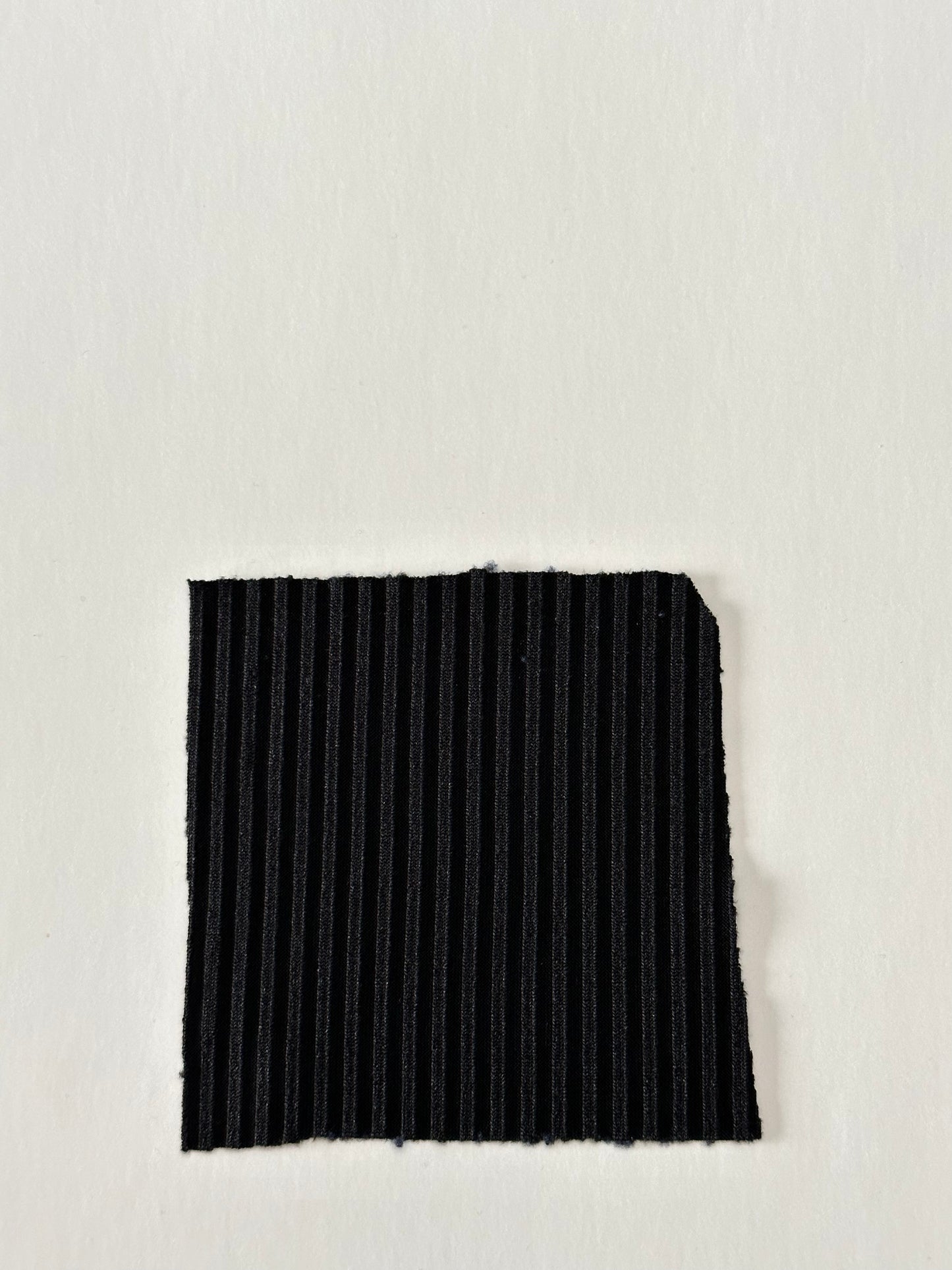 Solid in Black (new) on Unbrushed Rib Knit Fabric Sold by the 1/4 yard