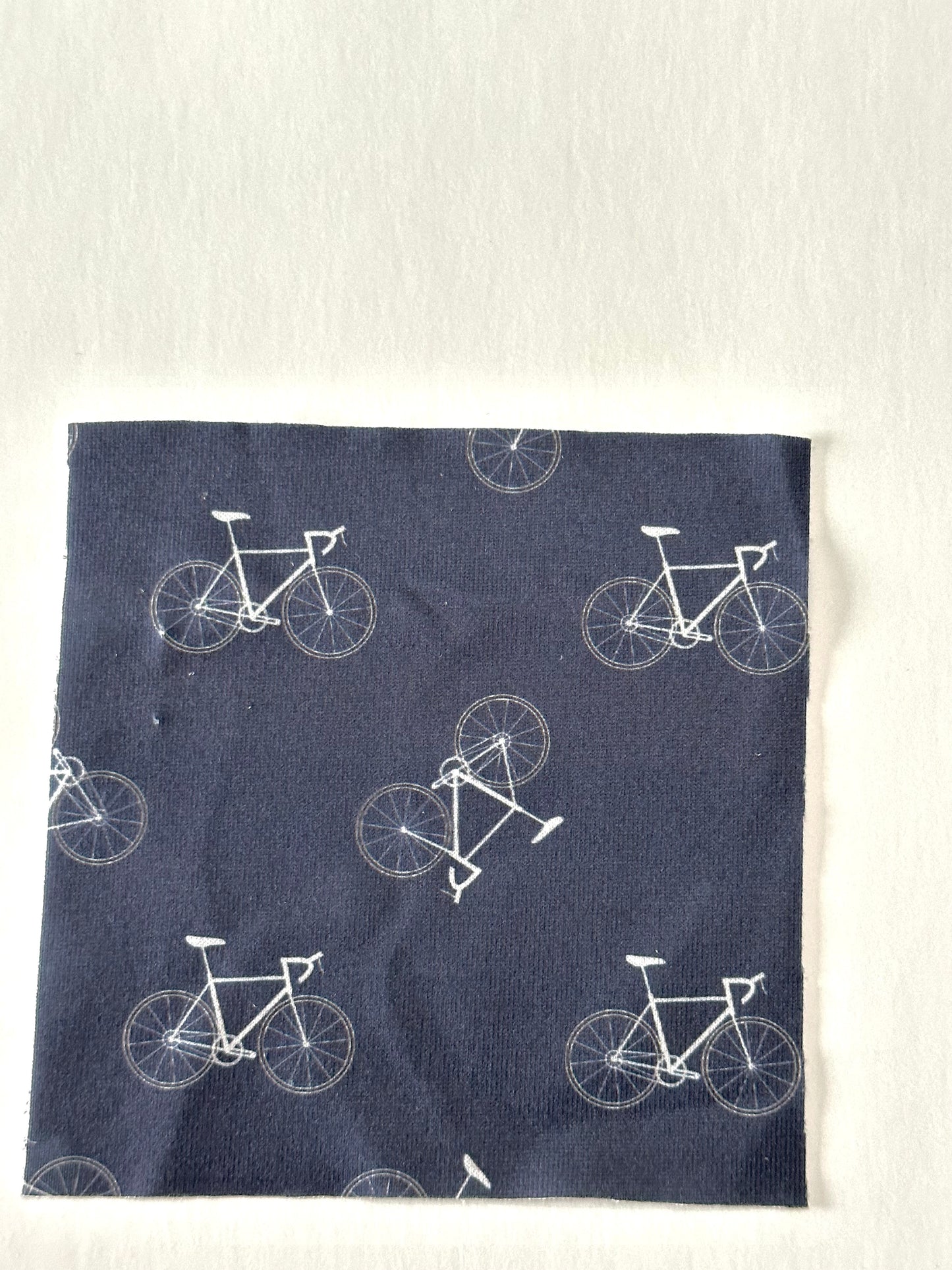 Bikes in Navy on Imitation Cotton Jersey Knit Fabric Sold by the 1/4 yard