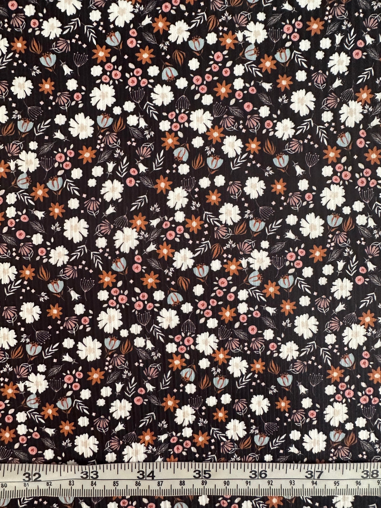 Amber Ditsy in Black on Brushed Rib Knit Fabric Sold by the 1/4 yard