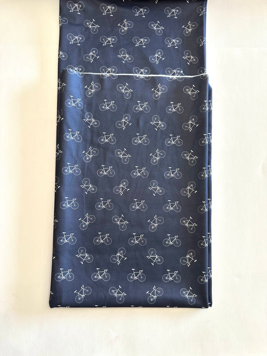 Bikes in Navy on Imitation Cotton Jersey Knit Fabric Sold by the 1/4 yard