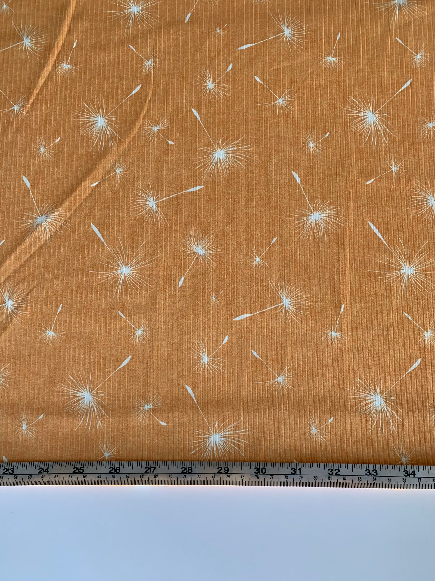 Dandelion Dust in Golden Yellow on Unbrushed Rib Knit Fabric Sold by the 1/4 yard
